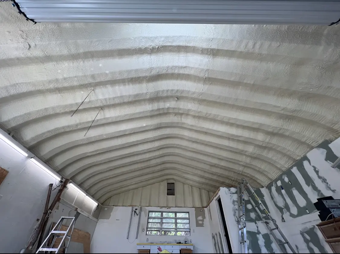 Spray polyurethane foam applied to the underside of a metal roof deck in The Woodlands